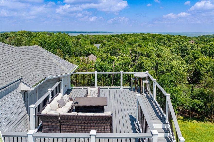 Live the lake lifestyle you’ve been dreaming of on beautiful Lake Texoma. Remodeled in 2017, this thoughtfully designed home offers an open-concept floorplan filled with natural light and elevated finishes throughout. From the hand-painted pine ceilings to the combination of quartz and granite countertops, every detail reflects comfort and quality. Two programmable gas fireplaces create a warm, inviting atmosphere, while the gourmet kitchen is equipped with top-of-the-line appliances—perfect for both everyday living and entertaining. Energy efficiency meets functionality with spray foam insulation, new buried propane tank, and the temperature-controlled garage doubles as a versatile game room, complete with an EV charger and a dedicated home office space. Outside, take in sweeping lake views from the expansive multi-level Trex deck. Enjoy year-round entertaining in the spacious screened-in porch, or unwind on cool evenings around the outdoor gas firepit. Located in Tanglewood Hills, less than a mile from Highport Marina and Tanglewood Resort featuring an Arnold Palmer-designed golf course. For dining, entertainment, and gaming, Choctaw Casino & Resort Durant is just a short 30-minute drive. Whether you’re looking for a full-time residence, weekend retreat, or investment opportunity, this home delivers the best of Texoma living.