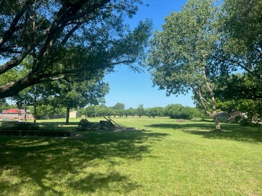 Beautiful building site on approximately 2 acre land in S&S school district.  Fenced with water meter and storage building.  Level with beautiful trees.