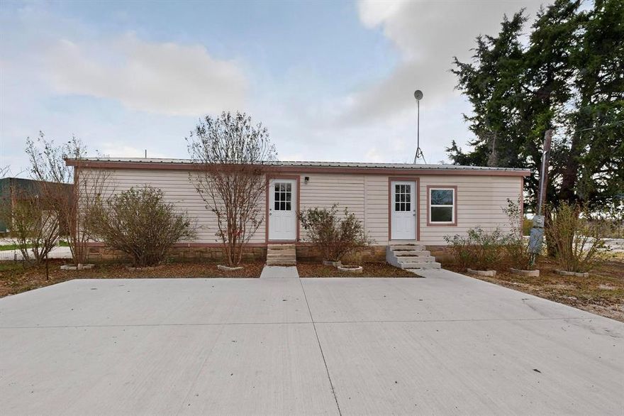 Nestled on a full acre outside city limits, this beautifully remodeled double wide offers the perfect blend of comfort, space, and country living. This home features 3 spacious bedrooms and 2 updated bathrooms with thoughtful finishes throughout. Step outside to your private oasis complete with an underground pool, a large covered porch, and an inviting outdoor fireplace that is perfect for hosting family and friends. The expansive carport provides plenty of room for work trucks, company vehicles, or extra storage. Enjoy peaceful living with room to spread out and no city restrictions. This property is move in ready and truly one of a kind