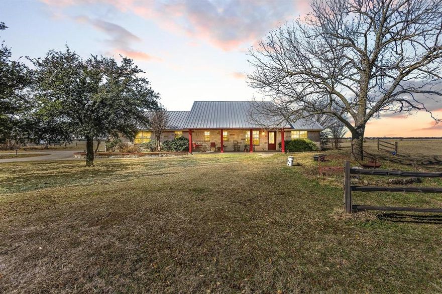 Welcome to 1233 FM 901 in rural North Texas: a custom built 1788sf 3 bed 2 bath ranch home sitting on 4.8 UNRESTRICTED acres with a 1200sf shop. Walking through this home, you can't help but appreciate its custom touches such as the custom cabinetry in the kitchen along with display shelves, accordion appliance hutch, two tier sink in addition to a prep sink in the island, pullout shelves in the pantry, and throughout crown moulding, trimmed windows, stone fireplace, wainscoting ceilings in the hall bath and one secondary bedroom, and a walk-in storage area in the garage. The primary suite offers a jetted tub, fireplace in the bathroom, standing shower, separate vanities, laundry shoot, large walk-in closet with built-ins, and doorway exit leading to the back porch. Exterior features include a metal roof, front and back porches that stretch across the home, stone and brick exterior, covered deck with a pergola and hot tub, a stone entrance that leads to the circle driveway, and pipe cross fence. The shop offers 1200sf of workshop, storage, or simply additional life space fully equipped with upgraded LED lighting, workbenches, a half bathroom, is wired for electric and plumbed, has its own septic system, with a RV hookup on the south side. This country property will be livestock ready with the easy addition of one cross fence. 25 minutes from Sherman, 45 minutes from McKinney and Frisco.