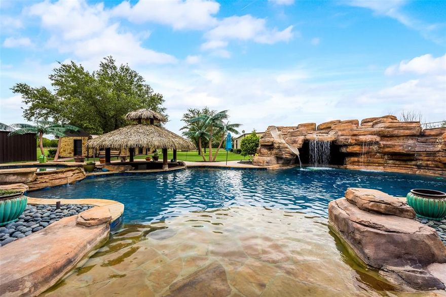 This newly renovated home sits on 5 beautiful acres, fully fenced, complete resort style pool with grotto swim up bar and huge covered back patio. High end luxury kitchen includes waterfall countertops, built in SS appliances and open concept living with incredible views of the outdoor pool and pond. Large primary bedroom with vaulted ceiling is located on its own wing of the home boasting incredible space, fantastic bathroom and storm proofed closet. Great size guest rooms with their own bath make this an incredible main home for the whole family. This property also includes full guest house with high end bathroom, full kitchen with loft style bedroom and 40k sqft of concrete with three full sized shops. Shops include car lift, office-workout room, car storage, car ports, and barn. This home is perfect for the business owner to work from home or or large family with livestock and toys.