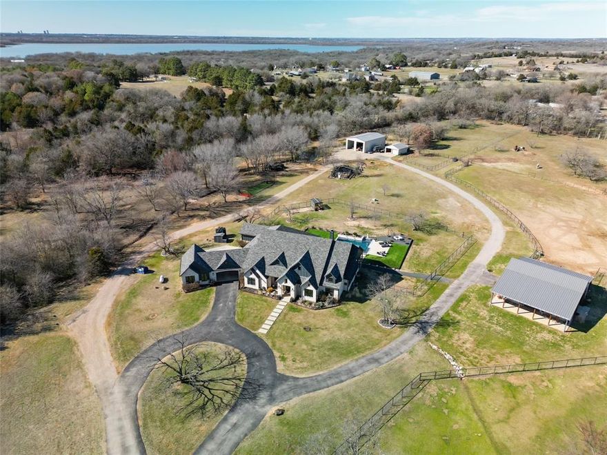 This one of a kind ranch home is perfect for the seclusion sought after by many. The gated property welcomes you to a simpler life with the amenities you expect from a luxury property. Totally foamed encapsulated home brings energy efficiency to the forefront. Professional grade appliances welcome the most discerning chef and the large island gives you the space to host any party. Walk through the iron and glass doors the backyard draws you to the pool surrounded by turf for easy maintenance. The night skies beckon you to the fire pit for star gazing the night away. A dream property for anyone wanting to have cattle, horses, and or any other farm animal you might want. Four stall horse barn with loft, tack room and storage.  With a chicken coop you don't have to worry about egg prices anymore. The ag exempt property comes with everything you need to keep your taxes low with rising property costs. RV storage or work barn with apartment loft. Close enough to the city for any other needs.