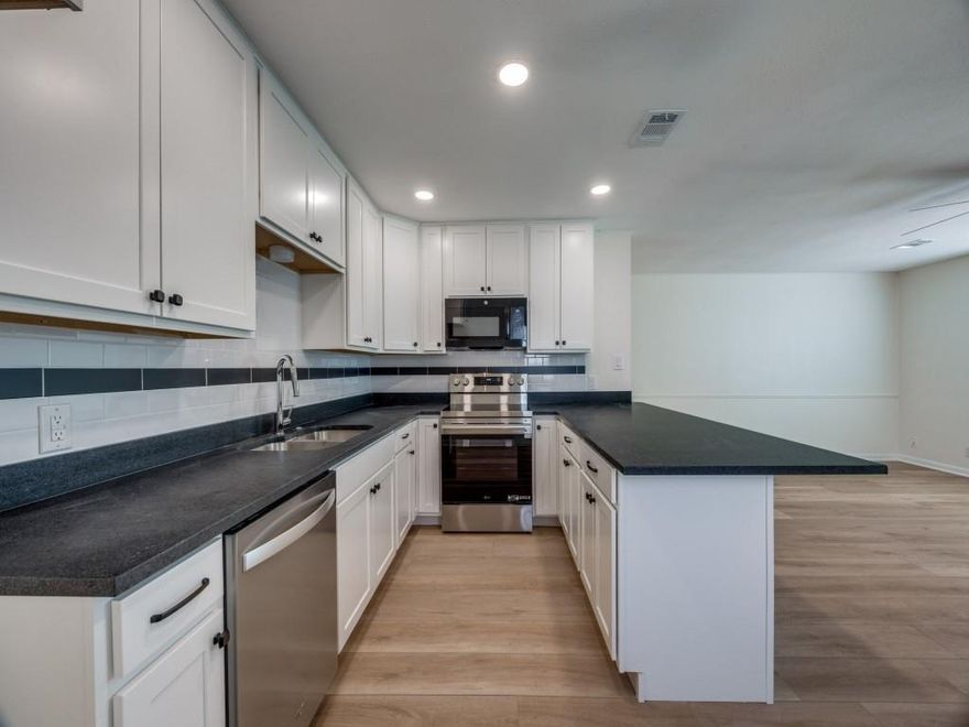 Completely Renovated 2-Bedroom Half Duplex – Move-In Ready! This beautifully updated 2-bedroom, 1-bath half duplex is one of the nicest and freshest units in the city. Featuring brand-new luxury vinyl plank flooring and fresh paint throughout, the home is filled with natural light and offers a bright, modern feel. The fully remodeled kitchen boasts new soft-close cabinets and drawers, a new dishwasher, range, microwave, and stylish backsplash. A peninsula provides additional counter space and overlooks the open-concept living area—perfect for entertaining.
The bathroom has been completely updated with modern tile, a new vanity, toilet, bathtub, and fixtures. Both bedrooms are generously sized with ample closet space, and new windows have been installed throughout the home.
Enjoy convenient rear parking with a dedicated parking pad. This is a turnkey property offering quality, comfort, and style—ready for you to move in! Includes yard care, refrigerator, washer and dryer.