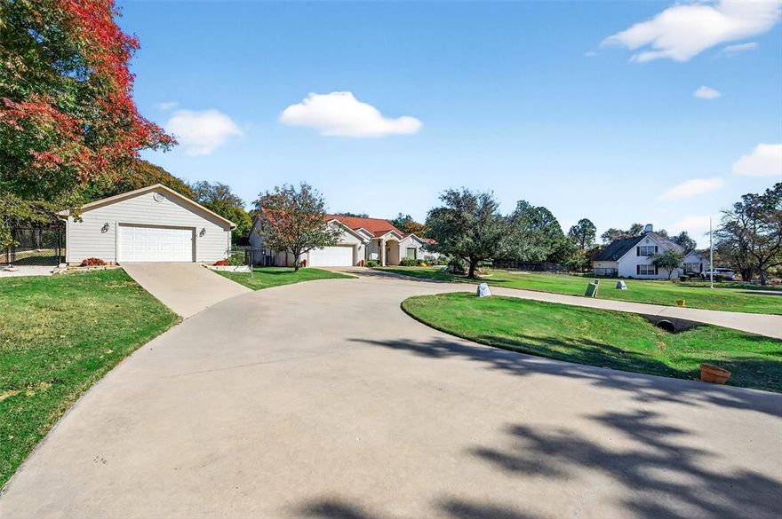One-of-a-Kind Lake Kiowa Gem on Triple Lot with Two Master Suites. Nestled on a serene 1.57-acre triple lot on the north side of Lake Kiowa, this Southwest-style home offers privacy, space, and character at every turn. From the moment you step inside, you’ll be captivated by the custom details, beautiful tile flooring, handcrafted tree-post accents, unique sconces & formal den.The primary master suite is truly a retreat, featuring room for a sitting area, seperate vanities plus a dedicated makeup vanity, a corner jetted tub, a custom walk-in shower and an extraordinary closet complete with built-in storage, seasonal upper shelving & shoe rack. The 2nd master suite offers its own luxury touches with dual vanities, a corner tub, a glass walk-in shower & walk in closet. Designed for both comfort and entertaining, the open living area includes a brick gas fireplace, hardwood floors, a built-in coffee bar, and a wall of windows that frame views of your beautiful private backyard. The kitchen opens to the living space and features stainless steel appliances, a gas cooktop, a long breakfast bar, and abundant counter space. You’ll also find a formal dining room & a dedicated office with extensive built-ins and a built-in desk. Step outside to your backyard oasis, complete with a covered patio stretching nearly the full width of the home. Enjoy views of mature trees within your fully fenced yard, enclosed by black wrought iron fencing with concrete footers for durability. A separate dog run includes a climate-controlled dog room (which could double as a workshop) just off the secondary garage. Above the main garage, discover a air conditioned and heated game room or man cave or also perfect for a fourth bedroom, media room, or private retreat. Both garages are generously sized. With its blend of craftsmanship, comfort and privacy, this Lake Kiowa treasure is a must have. Schedule a showing today and experience all that this remarkable home has to offer.