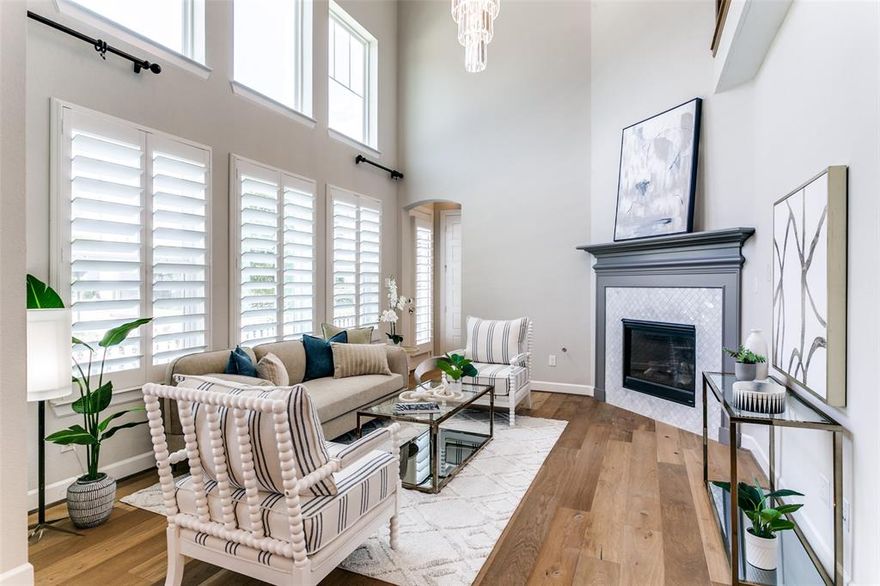 Immaculate David Weekley Home with Lake Views  Built in 2019
Welcome to this stunning David Weekley masterpiece, completed in 2019 and ideally positioned on a premium corner lot with direct views of the lake and walking trails right in front of the property. From the striking exterior to the thoughtfully designed interior, every detail of this home is built to impress.
Step inside to find rich, continuous hardwood flooring, a sleek open staircase, and upscale designer lighting. The gourmet kitchen is a showpiece, featuring ceiling-height shaker cabinetry, an oversized granite island, and abundant workspace—perfect for everyday living or entertaining guests.
The living room is breathtaking with its 20-foot ceilings, a full wall of windows that bring in natural light and picturesque views, and a dramatic designer chandelier that anchors the space with elegance.
Upstairs, you'll find the spacious primary retreat that overlooks the serene lake and surrounding neighborhood. The luxurious ensuite bath includes a walk-in shower with dual rain showerheads, marble herringbone tile flowing up the wall, and timeless white subway tile for a refined spa-like experience.
Adjacent to the primary suite is a second living area that opens to the level below, giving the home an airy and connected feel. A catwalk overlooking the living room leads to two additional bedrooms and a full bathroom.
This home combines luxury, comfort, and nature—with peaceful walking trails and lakefront serenity right outside your door. A true showstopper inside and out.