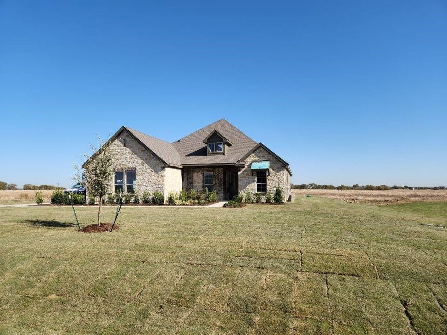 Estimated December 2025 completion! Ask us about our Trade In Trade Up program, we can buy your home! Introducing the brand new Bluebonnet Floorplan! This home offers over 2600 square feet with 4 bedrooms, 3 full bathrooms, study, formal dining, and plenty of space for the entire family! Enter through the covered front porch into the inviting foyer of the home. You will immediately see the private home office with french doors. The open living and kitchen areas are inviting and a perfect space for the family to gather. The expansive kitchen island overlooks the living room with stately corner fireplace. French doors will lead you out to the massive covered patio with an outdoor fireplace included! Private owner's suite is nestled in the back of the home and offers dual vanities, garden tub and separate shower. Don't miss out on your chance to live in the beautiful Rocky Top community!

This home will be zoned for Dixie Hansel Elementary which is currently under construction.