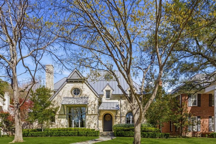 Beautifully crafted University Park residence set on a 70x160 lot, built by renowned builder Rusty Goff and meticulously maintained throughout. Spanning 5,914 square feet, this home showcases timeless architecture with a hand-chiseled stone exterior, antique wood floors and beams, and a dramatic living room anchored by a soaring 20-foot cathedral ceiling.
The first floor offers gracious formal living and dining spaces, a private study, spacious family room, and a chef’s kitchen complete with premium appliances, butler’s pantry, and walk-in pantry—designed for both everyday living and effortless entertaining.
Upstairs features three ensuite bedrooms, a game room, and an impressive primary suite with vaulted ceilings, dual walk-in closets, and a newly remodeled marble bath with a dedicated coffee bar.
A third-floor loft provides approximately 335 square feet of flexible bonus space.
The private backyard is a true retreat, complete with a screened porch, outdoor kitchen, and a resort-style pool and spa.
Ideally located just a short walk to UP Elementary and minutes from the dining and shops of Snider Plaza, this home offers the perfect blend of timeless design and everyday convenience.