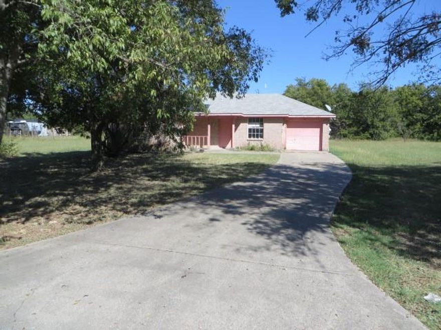 REDUCED! USDA AUCTION PROPERTY ON NEARLY 1-ACRE LOT!  This 4-bedroom, 2-bath brick home is situated on a spacious 0.91-acre lot with 1,175 sq. ft. of living space, a covered front porch, an attached garage, and mature trees for shade. The property is in need of repairs but offers an excellent opportunity for renovation and value-add potential for investors or handy buyers. SOLD AS-IS, WHERE-IS, without warranties.  Buyers and buyer’s agents are responsible for all due diligence. For more details, visit auction site MyNextBid.
Infrastructure Advisory: Buyers and agents encouraged to verify construction or planning for both FM6, FM1138 and surrounding area.