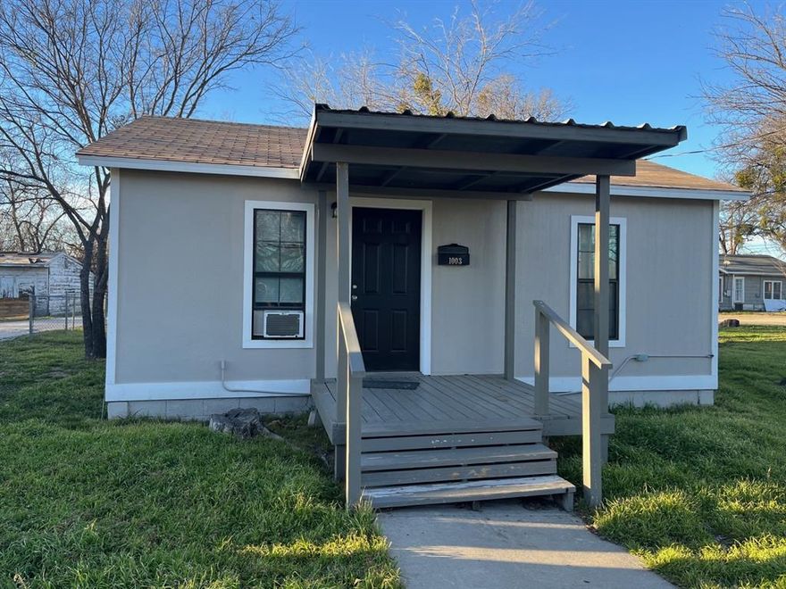 Nicely updated 2 bedroom, 1 bath home in an improving area.  Updated colors, flooring, new gas water heater, new kitchen and bathroom countertops in granite and marble.  This home has a nice sized master bedroom with double closets and an updated bathroom and utility room.  There is a small chain linked fence in the backyard and nice shade trees.