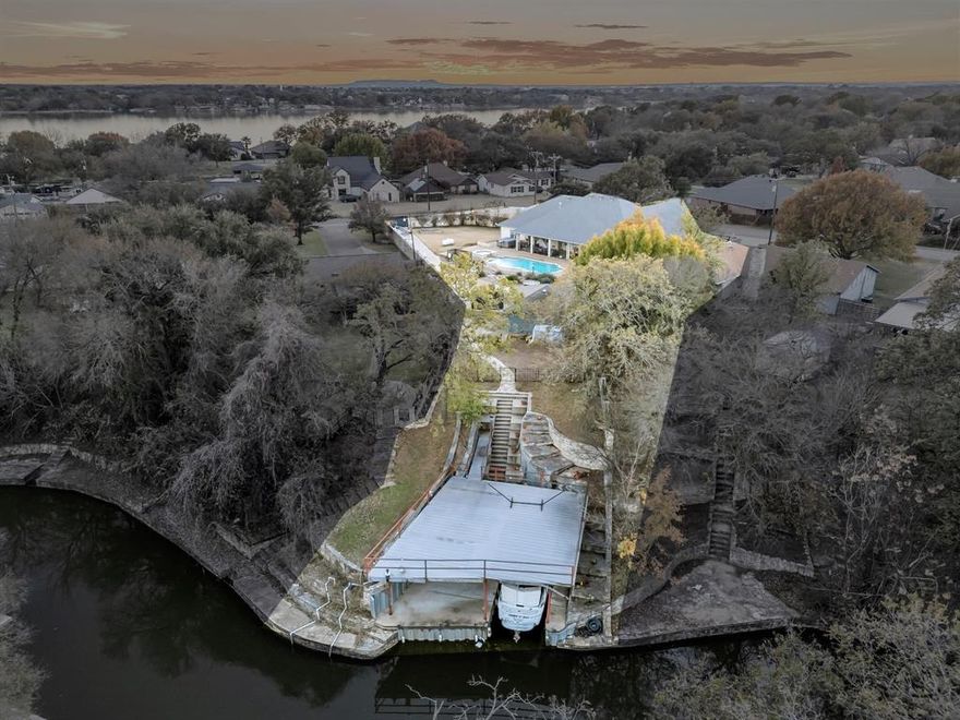 Experience easy lake living with water access in Laguna Tres Estates.

This 3 bedroom, 3.5 bathroom home delivers the kind of comfort, updates, and outdoor lifestyle that buyers look for in this neighborhood.

Step inside and the home feels instantly welcoming. Modern lighting, a formal dining room, and a refreshed kitchen with new Samsung appliances create a clean and stylish foundation. The layout keeps everything connected and makes the home feel open without losing that cozy, livable vibe. All three bedrooms are generously sized and the full bathrooms have been nicely updated. The half bath in the garage is perfect for anyone who spends time working on projects, tools, or hobbies without having to go through the main house.

The primary suite offers its own private access to the outdoor living area which makes morning coffee or late night swims feel effortless. A secondary bedroom also has outdoor access which works well for guests or anyone who appreciates a little extra independence.

Outside, the home delivers a true backyard retreat. The pool and built-in spa create a focal point that feels calm and inviting. The large hardscaped patio and outdoor living space are designed for gathering, grilling, lounging, and enjoying the good life at home. The 8 foot rock privacy fence gives the entire space a solid, upscale feel.  Drive through gates on each side of the house make easy accessibility for all of your trailers or RVs.

A private walkway leads you down to the canal where you will find your own boat dock with lift and a deck right at the water's edge. It is an easy place to launch the boat, unwind by the water, or head out for a day on the lake.

This home combines modern updates, outdoor living, and direct water access in a neighborhood that delivers the best of lake life in Laguna Tres Estates.