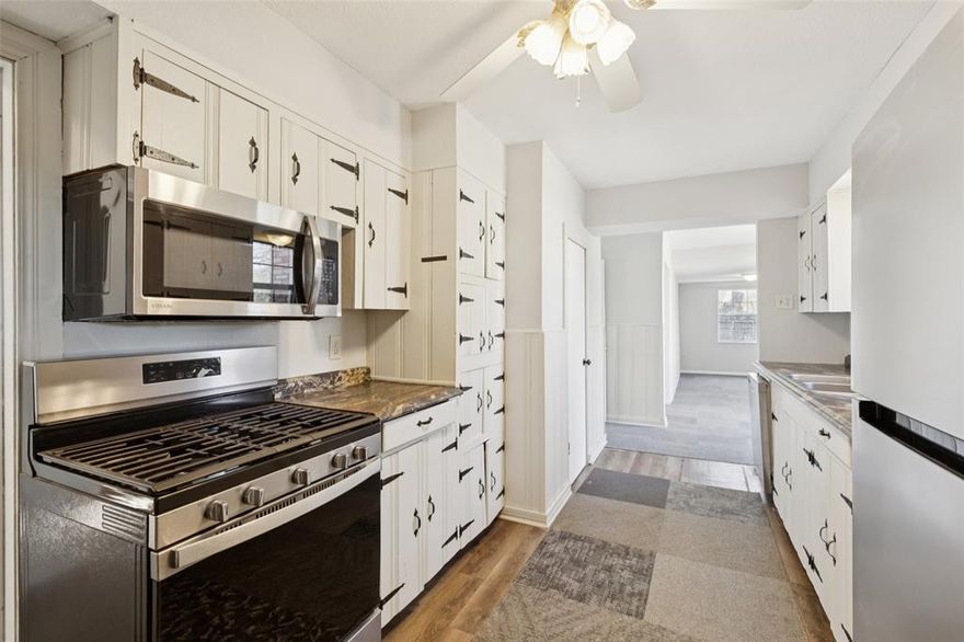 Charming 2 bedroom, 2 bath Dallas home is a blank canvas ready for you to make your own! This inviting property offers a unique and versatile floorplan with abundant natural light throughout. Enjoy the flexibility of two spacious living rooms, a formal dining room, and a bonus room that can easily serve as a home office, playroom, or creative studio—whatever suits your lifestyle. The kitchen features built-in appliances, generous cabinet space, and plenty of room to bring your culinary vision to life. The serene primary bedroom includes a private ensuite bath, and you’ll appreciate ample storage found in every corner of the home. Outside, you’re welcomed by an expansive yard filled with mature trees, offering both shade and space to relax or entertain. All of this in a fantastic location near parks, shopping, and dining—making everyday living both convenient and enjoyable. This home is full of potential and ready for your personal touch! 3D tour available online!