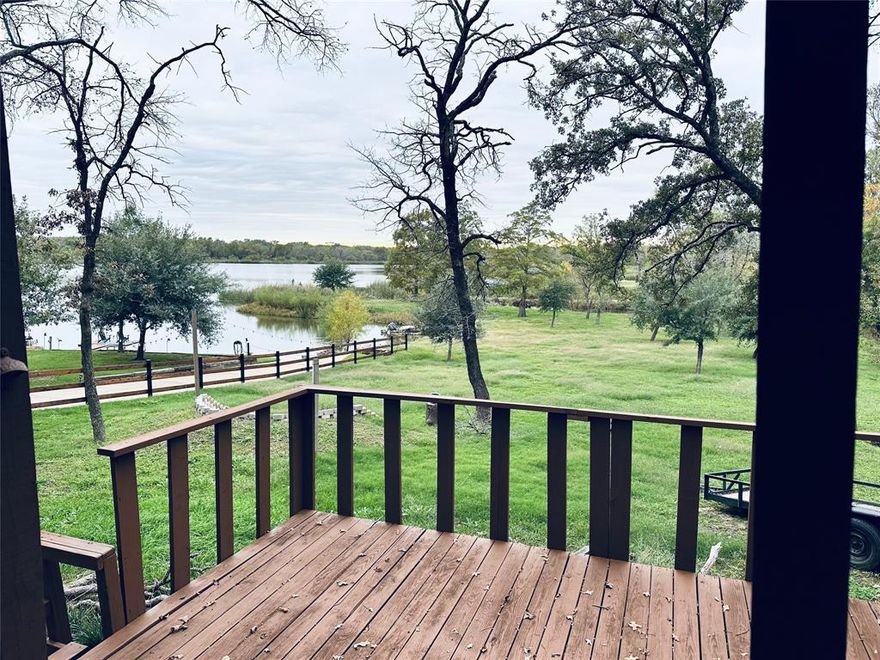 Experience lakeside living at its finest in this charming three-bedroom, two-bath retreat. Nestled against the serene backdrop of a beautiful lake, this cozy house offers breathtaking views that will captivate your sensos.  Whether you're enjoying a morning coffee on the deck or unwinding in the spacious living room, the tranquility of the lake is ever-present. With modern amenities and a warm, inviting atmosphere. Huge Primary bedroom with walking shower.