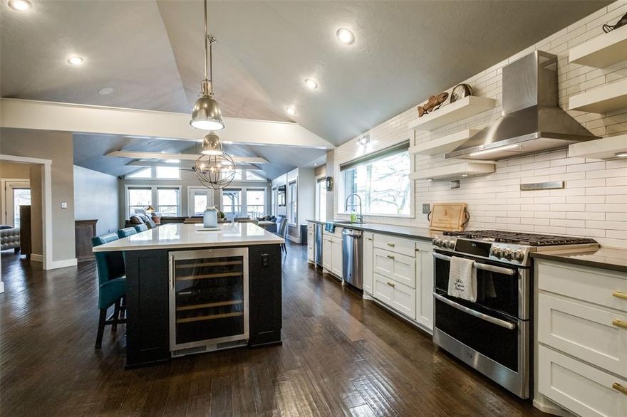 5% seller financing available with 15% down. Turnkey waterfront home. Updated with 7 BR, 7.5 BTH + large garage. East-facing cove location for safety, docking & afternoon shade. Stunning view of main lake. Updated top to bottom with gourmet kitchen, vaulted ceilings, wood floors, space to sleep 21 in beds. Main house is 5 BR 4 BA, with kitchenette downstairs that is convenient to the dock. Oversized party garage with HVAC with 2 BR, 3.5 BA bunkhouse above for guests. Large boathouse with custom storage on attic lifts! Large stone firepit. Automated with security alarm, remote shades, locks, Ring doorbells, water shut-off, thermostats, insect misters. 3 laundry areas. Sprinkler system. Kitchen has custom cabinets, gas range, huge island, quartz tops, wine & beverage refrigerators, ice maker and gorgeous views. Composite decks & dock.Meticulous updates & additions since 2014. Gated King’s Country has playground, tennis and pickleball courts, exercise & clubhouse. Furnishings negotiable.