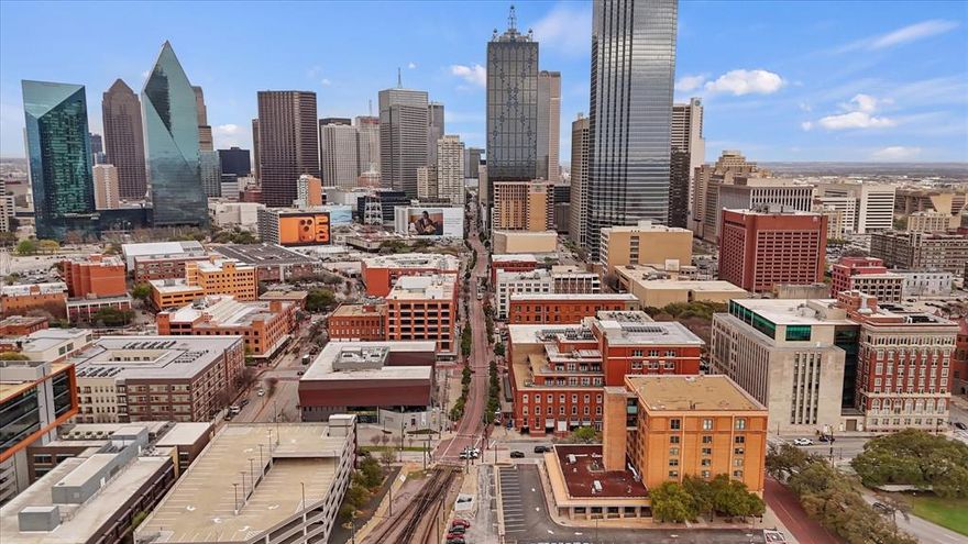 Here's your chance to own a piece of American history with a front-row view of the iconic Grassy Knoll! With views over Elm St, this stunning condo at 509 Elm St places you in the heart of downtown Dallas, just steps from the legendary Dealey Plaza, where history was forever changed. 

Step inside and discover soaring ceilings, beautifully preserved exposed brick, and original 1930s beams that give this residence an undeniable vintage charm. The wide-open floor plan is bathed in natural light, complemented by rich hardwood floors that flow throughout the living space & bedroom. The kitchen features stainless steel appliances and ample storage.

The generously sized bath offers a garden tub, double vanity, and a linen closet. 

Just steps from your front door, convenience awaits at every turn. A fitness room and tranquil courtyard sit on the same floor, directly across the hall. While secured entry in the front lobby ensures your peace of mind around the clock.

The neighborhood is nothing short of extraordinary. Dealey Plaza is a mere two-minute walk away, as well as public transit options within easy walking distance. From world-class dining to cultural attractions, downtown Dallas delivers an unmatched urban lifestyle.

Don't miss this rare opportunity to call a piece of history home! Schedule your showing today!...