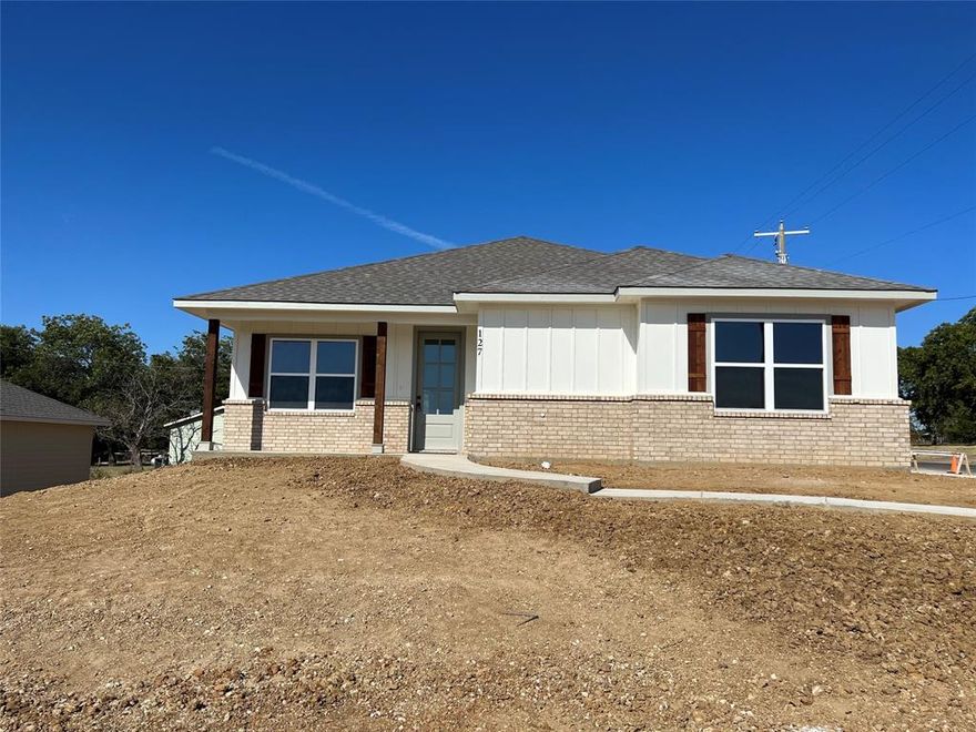 Beautiful New Construction Craftsman-Style Home with upgrades galore in New MW Landing PH II Addition.   This Corner Lot Home features: 3 bedrooms; 2 full baths; 2 Car Side Entry Garage with finished interior and attic storage; Open Floor plan Living with Eat-in Kitchen; Breakfast Bar; Shaker Style- Soft Close Cabinets; Stainless Steel Appliances; Quartz Countertops; Tile Backsplash; Farmhouse Sink; Pantry - Dining area - Luxury Vinyl Plank Waterproof Flooring throughout - Baths feature: Tile Surround Tubs & Showers; Quartz Countertops and Dual Vanity in Primary bath -Separate Laundry - Ceiling Fans & Decorative Lighting - Foam Insulation - Covered Front & Back Patio; 6 ft. Wood Privacy Fence & Partial Sod (Full Front) all at an Affordable Price for New Home Construction.  Don't Miss this great deal before it's gone!