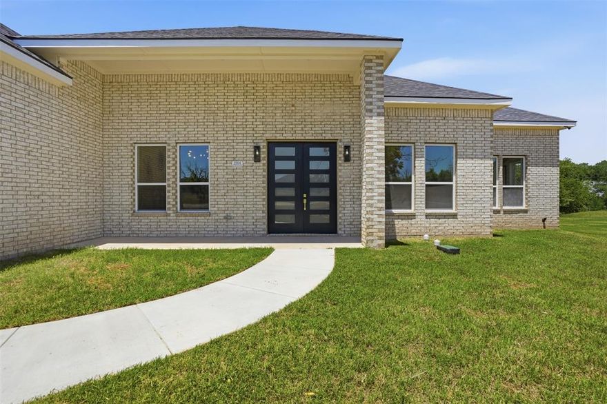 Tucked away on a cul-de-sac in the gated golf course community of Pecan Plantation this 2025-built home offers space, flexibility & the chance to enjoy one of Granbury’s most amenity-rich neighborhoods on nearly an acre. A short drive from both the front & back gates the property offers easy access in & out of Pecan Plantation. 4 bedrooms 3 full baths & a thoughtfully designed split-bedroom floorplan the layout was created with both functionality & privacy in mind. The soaring 12’ ceilings & oversized picture windows create an open, airy feel while filling the main living & dining areas with natural light. The heart of the home offers generous gathering space for everyday living or entertaining guest. The standout feature of the home is the dual primary suite design with one primary bedroom positioned on each end of the home. This setup is ideal for multigenerational living long-term guests or buyers who simply value privacy & flexibility. Main primary suite includes dual closets & a spacious en-suite bath with garden tub & separate shower while the 2nd primary suite also offers its own private bathroom. Secondary bedrooms are well-sized & positioned to maximize functionality throughout the home. The nearly 1 acre lot provides space to expand outdoor living areas, add landscaping, create a backyard retreat, or simply enjoy the extra elbow room that is becoming harder to find. The 3-car garage offers ample storage, parking or workspace flexibility. The home presents a strong option for buyers looking for square footage a modern floorplan & desirable location while still allowing room to personalize the space over time. Residents of Pecan Plantation enjoy an unmatched list of amenities including golf courses, country club dining, swimming pools, tennis courts, pickleball courts, parks, walking trails, equestrian facilities, marina, private airstrip  & gated security, all located just minutes from the historic Granbury square shopping, dining & entertainment.