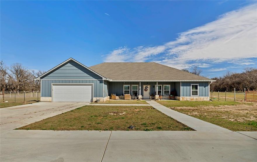 Welcome to peaceful country living on over 2.10 acres in Poolville! Built in 2025, this beautifully designed 3-bedroom, 2-bath home offers modern comfort combined with wide-open Texas space.

Inside, you’ll find a bright open-concept layout featuring a spacious living area, contemporary finishes, and a functional kitchen ideal for everyday living and entertaining. The home is complemented by a brand-new roundabout driveway and a recently installed heavy-duty concrete driveway leading to the newly built shop with electric already installed. The shop provides excellent space for equipment, storage, or workshop use. 

Enjoy the natural beauty of the land with a creek running along the backyard, where native Texas muscadine grapes grow seasonally — perfect for those interested in gardening or even small-batch winemaking. The property is fully suited for country lifestyles, offering ample space for farm animals, hobbies, or outdoor recreation.  

This property offers the ideal blend of modern construction, usable acreage, and functional improvements ready for its next owner.