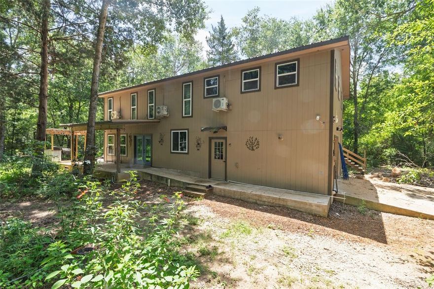 Welcome to 14313 Fm 645, 17 plus wooded acres pond property in beautiful Palestine, 2 years old construction with plenty of storage, beautiful kitchen with customs solid cabinets throughout, walk-in huge butler pantry, commercial grade stove ready for any occasion, spacious primary bedroom with custom bathroom and beautiful view of plenty wooded privacy forest, upstairs you will find a family room with 2 large rooms and a separated yet connected separate suite with full kitchen extra large room with walking closet and office or extra closet. this home promises not to disappoint any size family, from the large home with built-in garage and separate spacious shop or storage, few steps from main home you  will find the separate cottage with 400sft ready for company or extra living quarters. bring your toys to a new 300sqf  all secure metal storage and already RV electric hookups. this a most see one of a kind.