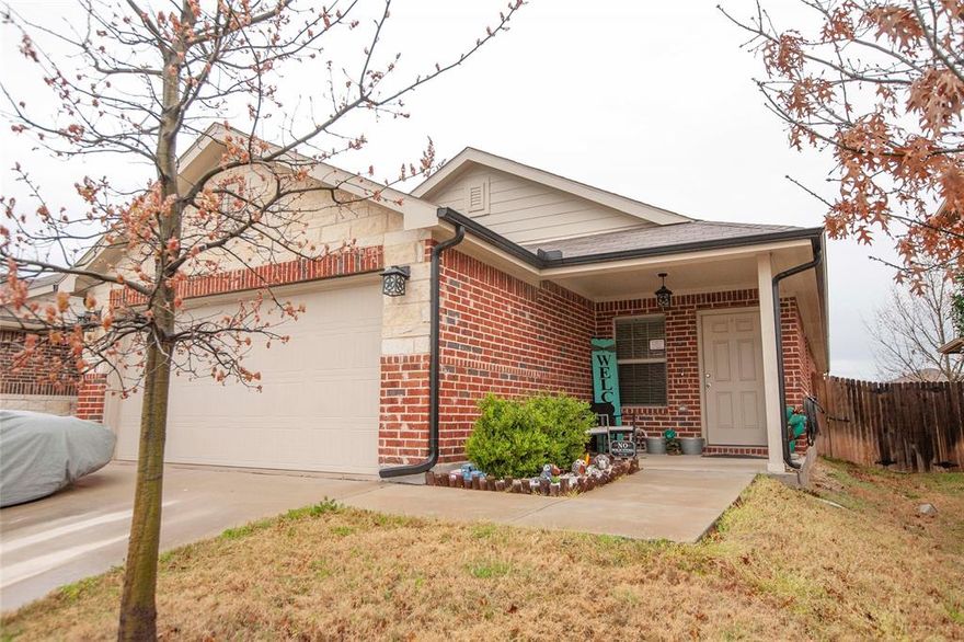 $5000 BUYER CREDIT TOWARD CLOSING COSTS* with acceptable offer. Single-story home has a smart layout for flexible living with 4 bedrooms and 2 bathrooms. Cozy front porch greets guests and through the front door leads to an open concept living area that is ideal for daily activities and entertaining with a modern kitchen, dining room, and family room, all side by side. Entry way is wide and has a nice nook for decor or creating your own storage for work & school gear. Three bedrooms share a hall bathroom at the front of the home, while the owner’s suite is tucked into the back with a private bathroom and large walk-in closet. The kitchen has elegant dark wood cabinets, black appliances and white quartz countertops with stainless steel sink. There is also a pantry in the kitchen for extra storage.  Durable and decorative medium brown wood-look Luxury vinyl plank flooring throughout home. Spacious laundry area in the hallway, has large doors to open while using or keep the area hidden. Upgraded, decorative lighting makes this home more modern, and the backyard has a privacy wood fence overlooking a green area providing distance from neighbors for extra relaxation in the backyard. ADT system to remain with home. **BONUS** Included with purchase is a One year Home Warranty with America's Preferred Home Warranty, Inc. - Choose your own licensed contractor with this warranty company. Buyer walked during Option Period due to personal concerns, not because of property. Inspection reports are available.