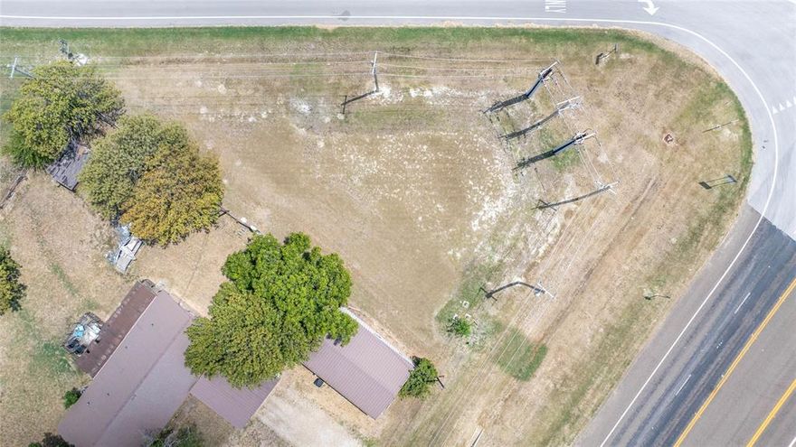Listed by Baldemar De Leon. Prime lot on State Highway 121 – Approx. 10,849 Sq. Ft. Don’t miss this unique opportunity to own a highly visible lot with direct frontage on State Highway 121 and Farm to Market Road 2862 (Houston st.). This property offers exceptional exposure and accessibility perfect for a variety of commercial or investment uses. Located just down the street from the exclusive G2 Motorsports Park, this site benefits from steady traffic and a growing area. With easy access to major highways and surrounding communities, it’s an ideal spot for your next venture.