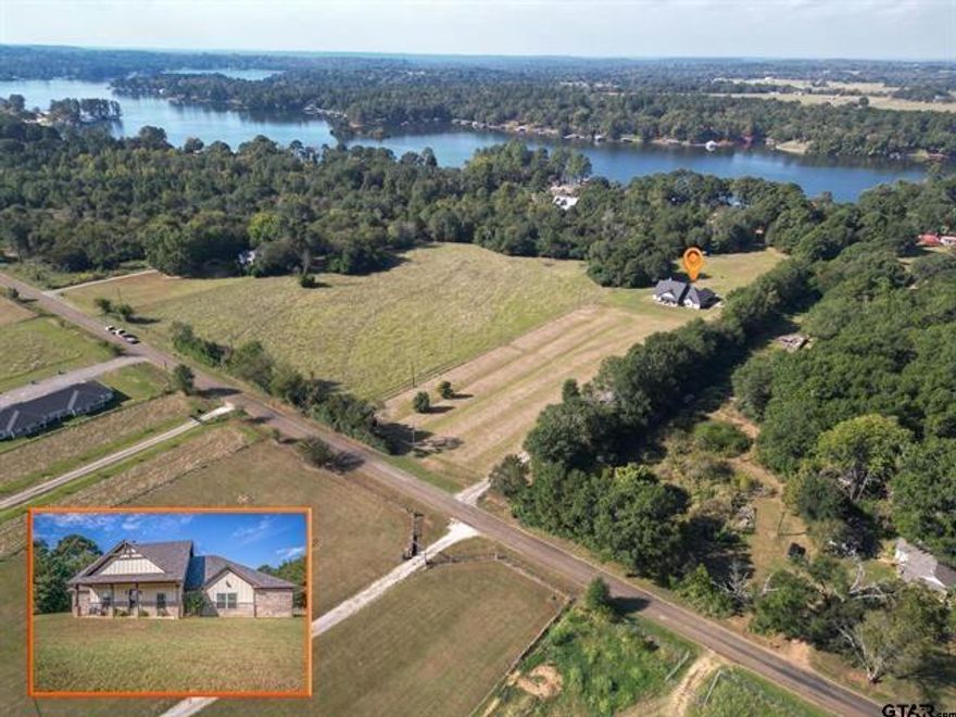 Built in 2021, this beautiful custom built 2,409 sq ft single-story residence sits on 5.75 open and fenced acres, offering the perfect blend of country living and modern comfort just minutes from town and within walking distance to the lake. Step inside to an inviting open-concept layout that seamlessly connects the kitchen, living, and dining areas ideal for entertaining and everyday living. The kitchen boasts stainless steel appliances, a large island, and a spacious walk-in pantry, perfect for any home chef. The living room features vaulted ceilings, a brick wood burning fireplace, and built-in storage. This flexible floor plan includes 4 bedrooms (or 3 bedrooms plus a game and media room) and 2.5 bathrooms, with a split master suite for added privacy. You’ll also find a dedicated office, a mud and laundry room, and plenty of thoughtful design touches throughout.Enjoy outdoor living year-round on the covered patio, complete with a hot tub that conveys. The property features a gated entrance and a long asphalt millings driveway, an attached 2-car carport, and a 24x8 storage room giving you all the space you need for your toys and tools. With city water, sewer, trash, and co-op electric and internet, you get all the conveniences of in-town living in a peaceful, private setting. There’s plenty of room to store ATVs, boats, and trailers and still space left to build the shop you’ve been dreaming of! Don't miss this rare opportunity to enjoy modern country living with unbeatable access to town and lake life.