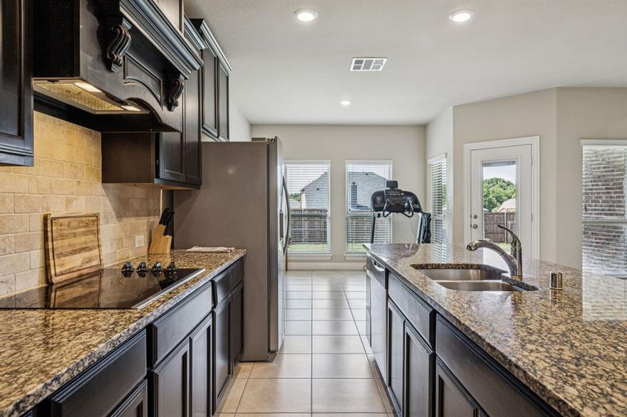 Stunning Price Improvement — Opportunity You Don’t Want to Miss! 

Welcome to 540 Winnetka — a beautifully maintained single-owner gem nestled on an oversized lot in the highly desirable Woodridge Estates community. From the moment you walk in, you’ll love the open, airy layout designed for both everyday living and effortless entertaining. Just off the entry foyer, a private study sits behind elegant French doors — perfect for working from home, a playroom, or a quiet retreat. The heart of the home is the spacious kitchen, featuring a large island, breakfast bar seating, and stainless steel appliances — all seamlessly opening to a bright living room with vaulted ceilings and a cozy built-in fireplace that creates the perfect gathering space. A formal dining area sits just off the kitchen, ready for holiday dinners, celebrations, and memory-making moments. The thoughtfully designed split floor plan offers privacy, with the primary suite tucked away on its own side of the home. This relaxing retreat includes an ensuite bath with a garden tub, separate shower, and a generously sized walk-in closet. Two additional bedrooms are located along the opposite hallway and share a well-appointed full bath — ideal for family or guests.

Additional highlights include:
• Newer roof
• Hard surface flooring throughout
• Separate laundry room with full-size connections
• Spacious fenced backyard
• Massive lot with room to play, garden, or entertain

All of this in an incredible location with quick access to major highways, shopping, dining, and Lake Lewisville recreation.
Move-in ready, single-owner, and priced to move — this is the one you’ve been waiting for