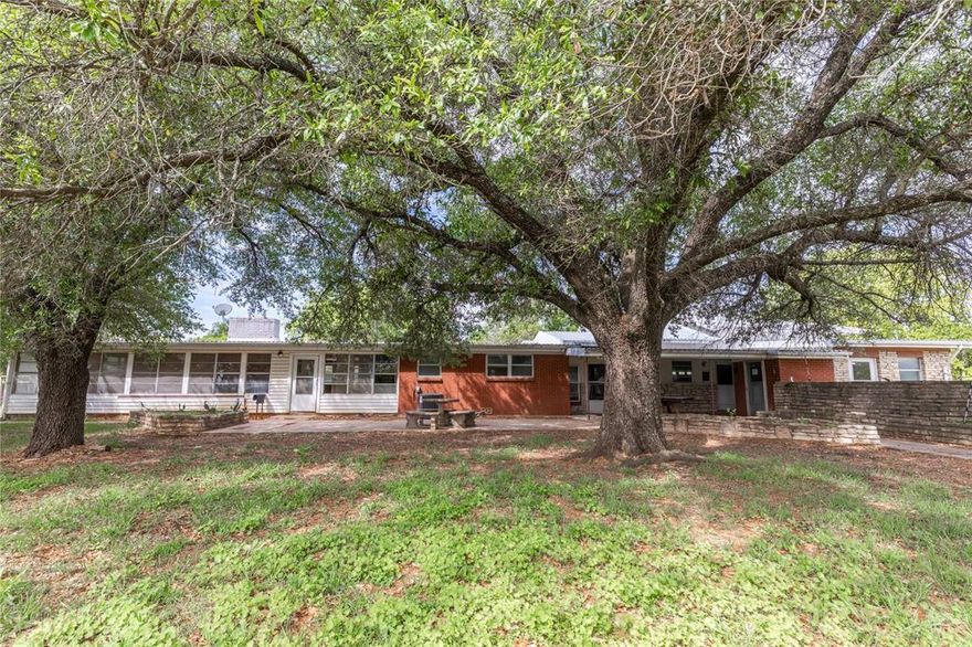 Location, Location, Location, Great Location right on Hwy 281 just south of the Hwy 281-67 intersection. Walking distance to Hard 8 BBQ. Tons of Opportunity for this 7.8 acres just outside of City Limits. Currently the home has been used as a Rental bringing in $2500 per mo. This Home is move in ready or with a little TLC it could be a spectacular show place again. A great Residential or Commercial property. The Shop could easily be rented out for $1500+ per month. It is currently their construction office. Still leaving lots of land to enjoy or put to work. Don't hesitate to see what can be done with this property. Schedule your showing today.