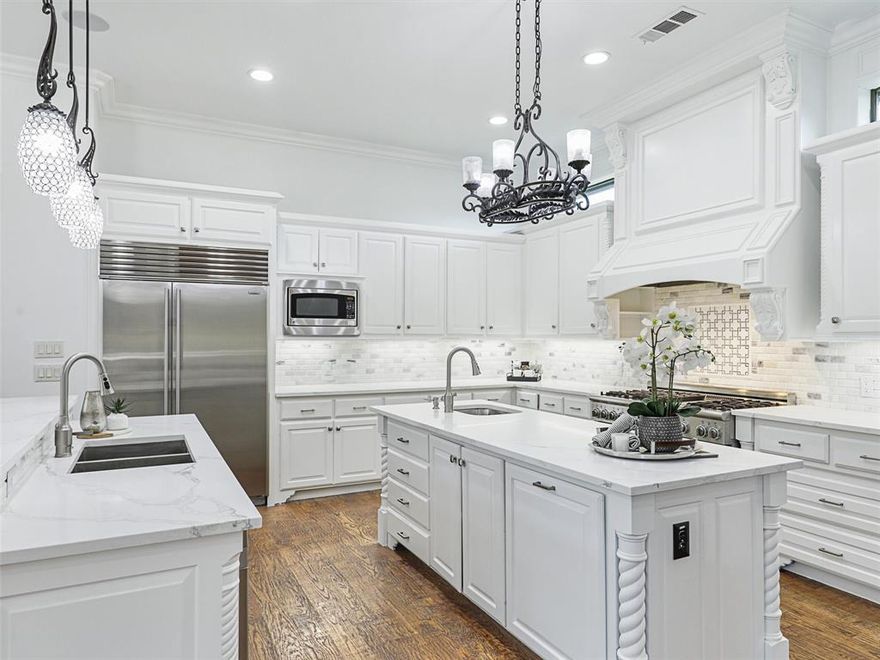 Freshly Painted, White & Bright interior!  Move in ready!!!  Welcome Home to this gorgeous, custom home in Sandlin Manor with the Backyard Oasis of your dreams! Ready for fun, this home boasts a spacious private backyard with large sparkling pool, water features, spa, new landscaping, covered outdoor kitchen, multiple sitting areas, new privacy fence + tons of grass for kids & pets to play. Park on the circular drive & enter to soaring ceilings, custom millwork, wood floors, open floor plan + perfect views to the lovely backyard. Beautiful Formals with fireplace + sep Wine Room lead to Great Room. Updated White Kitchen with 2 islands, comm appliances, Breakfast area overlooking the pool + large Family with soaring fireplace. Adjacent Media Room has Wet Bar for entertaining. Executive Study, private Primary suite w spa bath + huge closet, and Guest suite are down. Upstairs boasts 3 bedrooms, Game room with wet bar, large Bonus-Exercise room + study area. 4 car garage + driveway gate.