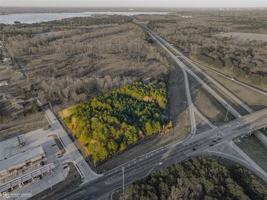 High traffic area at corner of Lakeside Dr & Jefferson Paige Rd - immediately off Interstate 220. Zoned C3 (General Commercial). Within city limits. This property is not in a flood zone. Newly built gas station next door. Available utilities at street - SWEPCO electric, Centerpoint gas, DOWAS water & sewer. Mineral rights reserved.