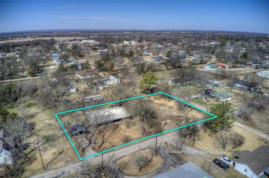 Over a half-acre corner lot with a doublewide that needs a little TLC to make it your way. Could be split into 2 parcels and you can build two custom homes. Has a carport and a 50 amp plug for a travel trailer. The property has pecan trees, oak trees, along with several other varieties. Bring your family to the sought-after Lone Oak ISD school district. Survey done 2022