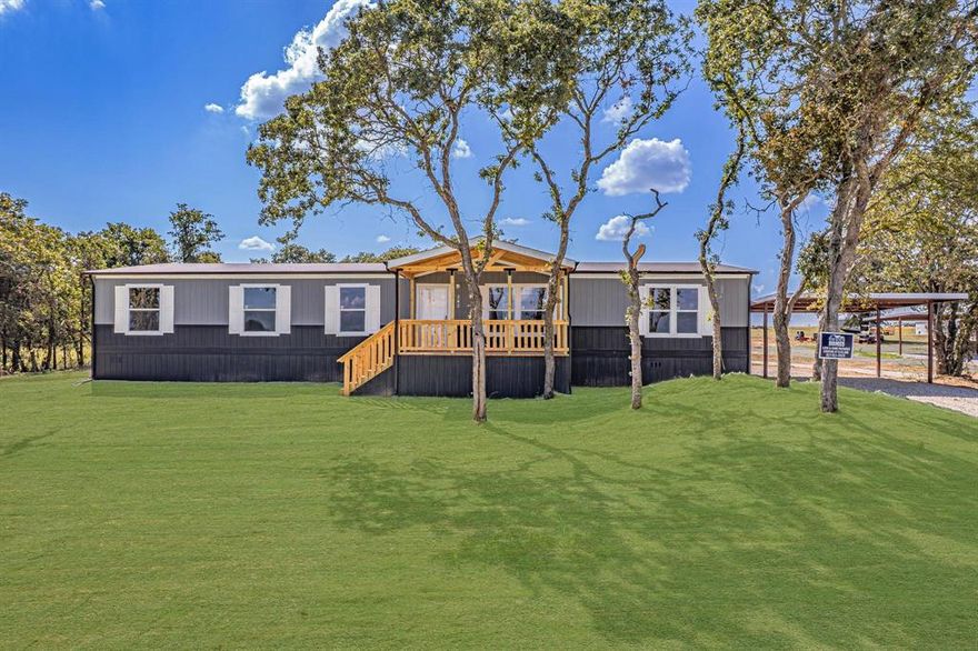 Perfectly tucked among mature trees, this stunning new construction blends modern elegance with peaceful, natural surroundings. Expansive windows fill the open-concept living area with beautiful natural light, creating a warm and inviting atmosphere. Thoughtfully designed with stylish finishes throughout, this home offers a true retreat from the everyday. Situated on a generous 2.84-acre lot, this 4-bedroom, 2-bathroom home provides plenty of space to live, relax, and entertain. The open layout features recessed lighting and a well-appointed kitchen complete with a refrigerator, dishwasher, range, and center island—perfect for gathering and everyday living. The spacious primary suite includes a walk-in closet and private en-suite bath, while three additional bedrooms offer flexibility for family, guests, or a home office. Enjoy the outdoors from the expansive front and back decks, ideal for entertaining or unwinding in a serene setting. Additional features include a 2-car carport, smart panel skirting, wainscoting, rain gutters, private septic system, and private well. Horses are welcome, and there is no HOA. Whether you're hosting guests or enjoying the quiet beauty of your land, this property delivers comfort, style, and room to make it your own. Schedule your showing today! FHA, VA, USDA, and Conventional financing accepted. All information deemed reliable but not guaranteed. Buyer and buyer’s agent to verify all information, including construction status, lot dimensions, easements, school district, and any applicable restrictions. Buyer to confirm completion status prior to inspections.