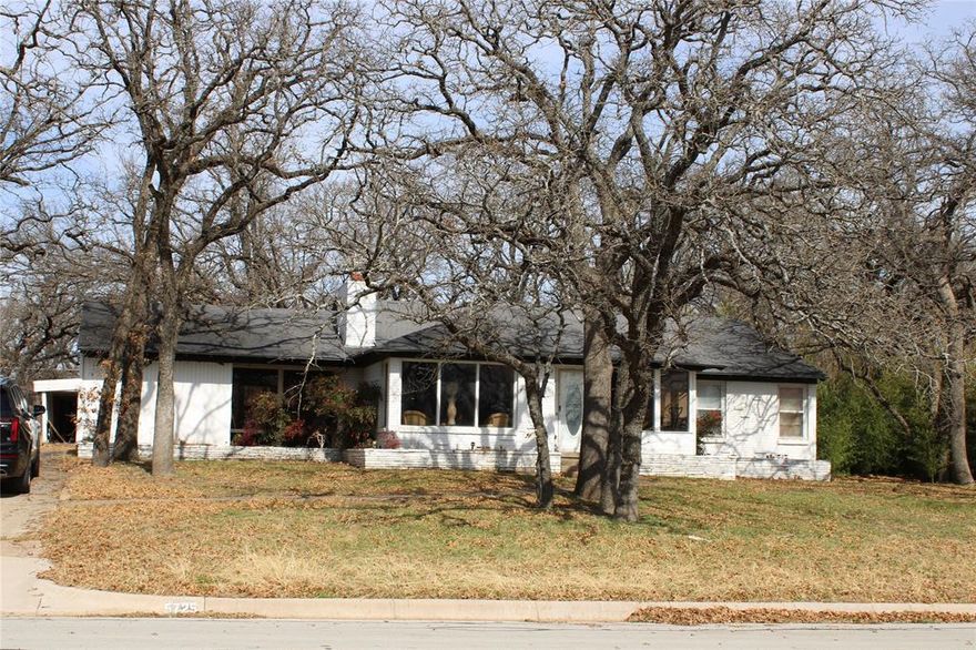 This is an amazing property with good bones. It will take you back to the 1950's though it has several modern updates. This neighborhood is the one that has stood the test of time with large trees and solid homes. The floorplan is well thought out and flows nicely room to room. The large lot is very peaceful and provides for lots of beautiful landscaping options. The home needs a new roof and an updated electrical panel though all is functioning now without failure. Some new flooring and paint would be an amazing option to restore natural beauty. The carport really need a complete rebuild but the asphalt is laid and ready for such. It is a perfect opportunity to buy into the most desirable part  of a neighborhood at a greatly reduced price.