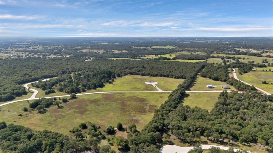 Embrace the tranquility of Texas country living in The Reserve at Shadle—a private, gated community nestled in charming Poolville. With paved roads, underground utilities, and spacious 2+ acre homesites, this neighborhood offers the ideal blend of peaceful rural life and modern convenience. Minimum build size is 1,250 sq ft, giving you the flexibility to design the custom home, barndominium, or shop you’ve always dreamed of. Lot highlights include wide-open views, plenty of space for your animals, and the privacy that only a scenic setting like this can offer. Located just 20 minutes from both Weatherford and Springtown, you’ll enjoy easy access to town while savoring the quietness of the countryside. Don’t miss this opportunity to build your future in one of Poolville’s most sought-after communities.