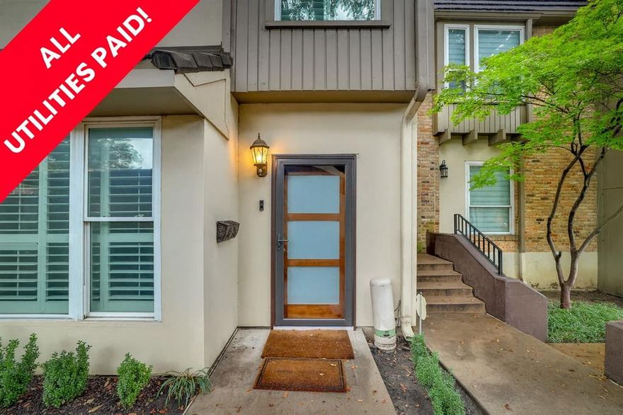 All utilities are paid in this beautiful condo nestled away in Perry Heights in the heart of Oak Lawn, offering elegance and charm, with updates galore. Minutes away from nightlife, restaurants, the medical district, and Love Field, and a short walk across the street to Craddock Park for tennis or dog play. You’ll love walking into the spacious living room, with wood burning fireplace, on to the dining room and island kitchen, updated with granite countertops, stainless steel appliances, tons of cabinets, double oven, a wine cooler, and a built-in refrigerator.  French doors lead you to a private courtyard, perfect for entertaining guests, and a two car garage. Two bedrooms on the second floor, each with updated ensuite baths, have big walk-in closets and extra storage closets. You won’t believe the size of the primary suite, with an updated bathroom and tons of closet space. An extra flex space, on the third level, is perfect for an office. New full sized stackable washer and dryer are also included on the third level. This complex includes a nice community pool for your enjoyment. Electricity, water, trash, sewer is included in the rent. Tenants will be responsible for renters insurance and cable or internet. Each tenant over the age of 18 will submit application and pay $47 for credit and criminals background check.