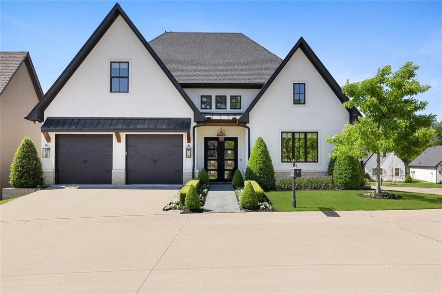 Welcome to this stunning 2019 custom built stucco and stone home in the exclusive gated Villas of Hollytree. Thoughtfully designed and impeccably upgraded, this home blends timeless elegance with modern luxury. The chef’s kitchen is a showstopper, featuring vaulted ceilings, designer lighting, marble countertops and backsplash with a custom edge, and top tier appliances including Wolf, Sub Zero, and KitchenAid. White oak floors flow throughout, complemented by ship lap walls, antique lighting, and custom wood beams. The living room, with a cast stone fireplace and two sets of French doors, is bathed in natural light and opens seamlessly to the outdoor living area. The spacious primary suite on the main floor is a serene retreat with large windows, automatic blinds, ship lap accents, and custom beams. The spa-like primary bath boasts Calcutta marble flooring, dual vanities, a large soaking tub with satin brass finishes, and a walk-through marble shower. A massive custom walk-in closet includes his-and-hers built-ins, designer chandeliers, custom mirrors, and a secure valuables space. A stylish study or den provides a perfect work from home setup with ship lap walls, built ins, and a custom desk. The main-level powder bath features elegant finishes including a stone sink, antique mirror, and brass accents. Upstairs, you’ll find two generous bedrooms connected by a Jack-and-Jill bathroom with decorative concrete tile and marble countertops; one bedroom includes a built-in desk or vanity space, ideal for a media room or office. The laundry room includes custom cabinetry, marble surfaces, and ample storage. Step outside to your private backyard oasis with custom turf, a blue stone patio, limestone entertaining area, putting green, stainless steel cooking station, professional landscaping, and iron fencing.  All situated on a premium corner lot offering unmatched style, comfort, and privacy.