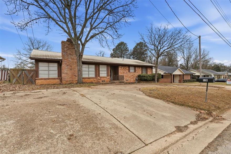 Welcome to this well-maintained 3-bedroom, 2-bath brick home located in an all-brick neighborhood, offering comfort, convenience, and versatility. The home features a over-sized open living and dining area anchored by a cozy wood-burning fireplace, perfect for everyday living and entertaining. Enjoy central heat and air, along with interior updates that add to the homes appeal. The kitchen comes fully equipped with a stove, microwave vent hood, refrigerator, and dishwasher, and the washer and dryer will also remain, making this home truly move-in ready. Outside, you'll find metal and wood fencing, two storage buildings, and a valuable bonus - a two-story guest house, ideal for guests, extended family, or additional living space Conveniently located close to shopping and restaurants, this property offers a blend of practicality and charm. A great opportunity with space, extras, and location all in one.