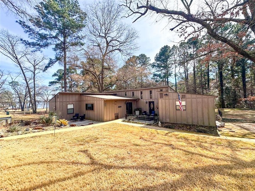 Beautiful waterfront canal home located in Frankston, Texas, offering approximately 1,980 square feet with a desirable split-bedroom floor plan. This inviting property features a circle driveway and sits back from the road, providing added privacy and curb appeal. Situated on a canal off Lake Palestine, the home offers peaceful water access and a large yard with plenty of space for outdoor enjoyment. Relax on the back porch and take in the refreshing lake breeze — the perfect spot for morning coffee or evening sunsets. A wonderful opportunity to enjoy lake living in a serene setting