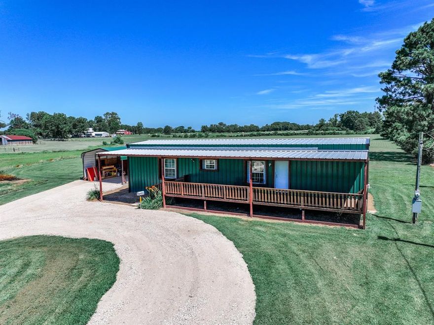 This beautiful property has been very well maintained. Charming mobile home with 2 bedrooms and 2 full bathrooms sitting on 5 acres of land. Some updates include a new front 40x10 covered deck and a back 25x10 covered deck.  New metal siding for double insulation and the windows have been reframed. A new circle driveway has been added.  Property has a new storage building and a 20x20 carport.   Property has a stocked pond and the back of the property is fenced.   Property is just outside of town but close to Mother Christus hospital, restaurants and shopping. The tractor and some furniture is negotiable.