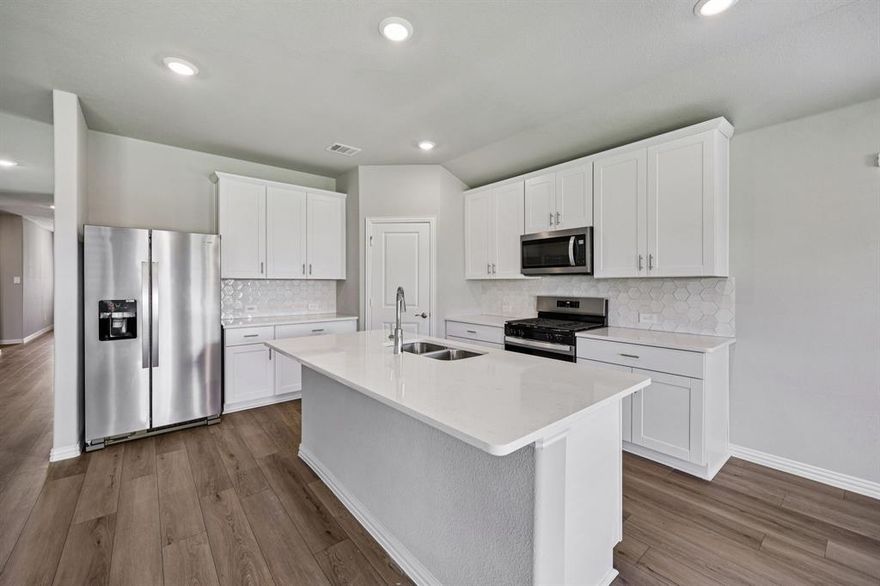 BRAND NEW energy - efficient home Mar 2026! Sip your morning coffee at the Henderson's convenient kitchen island overlooking the dining and family rooms. White cabinets with veined white quartz countertops, tan tone EVP flooring and light grey brown textured carpet. Escape the bustle of the city without being too far from the action. Beat the summer heat at the neighborhood amenity center complete with a resort-style pool. Zoned in the sought-after Crowley ISD, Tesoro at Chisholm Trail Ranch offers six floor plans to fit your family’s lifestyle. We also build each home with energy-efficient features that cut down on utility bills so you can afford to do more living.* Each of our homes is built with innovative, energy-efficient features designed to help you enjoy more savings, better health, real comfort and peace of mind.