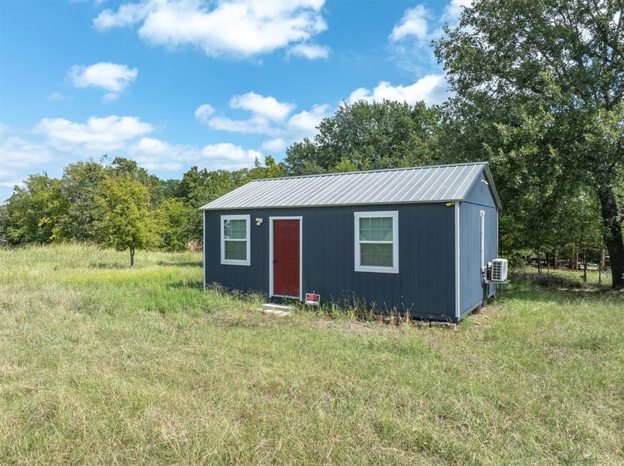 Seize the chance to own nearly ¾ of an acre in the highly sought-after Holiday Estates subdivision—a gem within one of Lake Tawakoni’s most desirable communities. This unique property features three cleared, contiguous lots with dual access from Pump Station Road (CR3706) and Tomahawk Trail, offering endless possibilities for building and development.

Nestled on the property is a charming 16’x24’ tiny home, thoughtfully designed with upcycled wood paneling, a brand-new mini-split HVAC system to keep you comfortable year-round, sleek modern ceiling fans with drop-down lighting, and a 200-amp circuit ready to power full appliances. (Furniture negotiable!) For added convenience, there’s also a 20’ Conex storage unit—perfect for stowing fishing gear, lawn equipment, or all your favorite lake toys.

With ample space to bring your vision to life, you can design your dream lake retreat with room for a custom home, workshop, RV, boat storage, or all of the above. Use the tiny home as a cozy guest house or a weekend escape while you build.

Holiday Estates residents enjoy no HOA fees and exclusive access to their private boat ramp, just around the corner. For even more water access, a large public ramp is only minutes away. Plus, Lake Tawakoni State Park is just a short 15-minute drive. Known as the Catfish Capital of Texas, Lake Tawakoni is a fishing haven and a favorite spot for outdoor enthusiasts.

Opportunities like this don’t come around often. Undeveloped land in Holiday Estates is a rare find, and with these upgrades and possibilities, this property is truly one-of-a-kind. Don’t let this once-in-a-lifetime chance slip away!

3 lots.  Seller would consider selling separately
