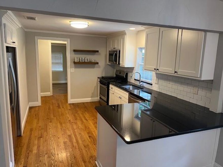 Welcome to 117 Ida Street in McKinney’s Mill District! This renovated home features elegant dark granite countertops, a practical breakfast bar, and hardwood floors throughout. The living room is enhanced by a charming cedar beam, adding character and warmth.

The kitchen comes equipped with stainless steel appliances, including a refrigerator, oven, and microwave, along with ample counter space. This home is move-in ready and has been thoughtfully updated, blending modern amenities with timeless charm.

Outside, you'll find a spacious yard and a convenient shed for additional storage. The primary bedroom is generously sized and features a bathroom with dual sinks.

This property has been a profitable rental home, and it remains highly rentable, making it a great investment opportunity. The home is conveniently located near McKinney’s downtown square and the historic Chestnut Square village, providing easy access to dining, shopping, and entertainment. The covered carport can also serve as an outdoor relaxation area.