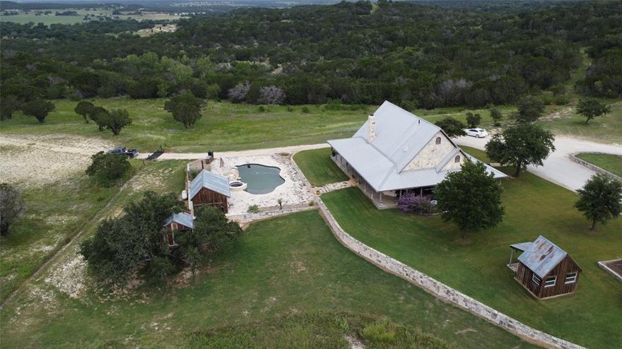 This 160+ acre ranch only 16 miles from Granbury, Texas and is highly improved. With a 2009 custom built 2,398 sf home sporting 3 bedrooms and 2.5 baths, hardwood floors, pinewood walls, office loft, open concept kitchen with top of the line appliances, large laundry room, high ceilings, wood windows, metal roof, and the list goes on. It boasts a beautiful in ground heated pool with spa, an outdoor kitchen, cabana with .5 bath, and a treehouse for the kids to enjoy. There are two good stock tanks on the property with a great location for a third. This property has a great water well, and on site septic system. Chicken coupe, gardening shack, garden, tiny home pad with septic & water & electricity at site, and a massive covered equipment barn complete with a drive through shop 42 x 60 for the storage of your many many ranch toys. Owner believes that he owns 25% of the minerals which will convey with an acceptable offer.