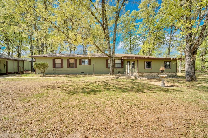 If you’ve been craving space, trees, and a slower pace of life, this one feels like stepping into your own private piece of the countryside.

Set on 13 gated acres, this property is all about the land. Mature trees stretch across the acreage, creating a sense of privacy and that tucked-away feel that’s getting harder to find. Whether it’s early mornings with coffee on the porch, afternoons spent casting a line into your own pond, or evenings watching the sunset filter through the trees, this is the kind of place that invites you to slow down and stay awhile.

There’s plenty of room here to build out your vision of a homestead. Think gardens, chickens, a few head of cattle, or just wide-open space to roam. The pond adds both function and charm, offering a peaceful spot to fish or simply enjoy the view. A storage shed gives you space for tools and equipment, making it easy to maintain the land and bring your ideas to life. The garage with roll up door functions as a the perfect shop space!

The main home offers 3 bedrooms and 2 bathrooms, with a warm and inviting layout. One of the standout features is the cedar-lined bonus living room, a flexible space that could easily serve as a second living area, game room, office, or whatever fits your lifestyle best.

Tucked away on the property, the guest house with its own bedroom and bathroom adds even more versatility. It’s ideal for visitors, extended stays, or a private workspace set apart from the main home.

Properties like this don’t come around often. Land, trees, water, and flexibility all in one—this is the kind of place you can truly make your own.