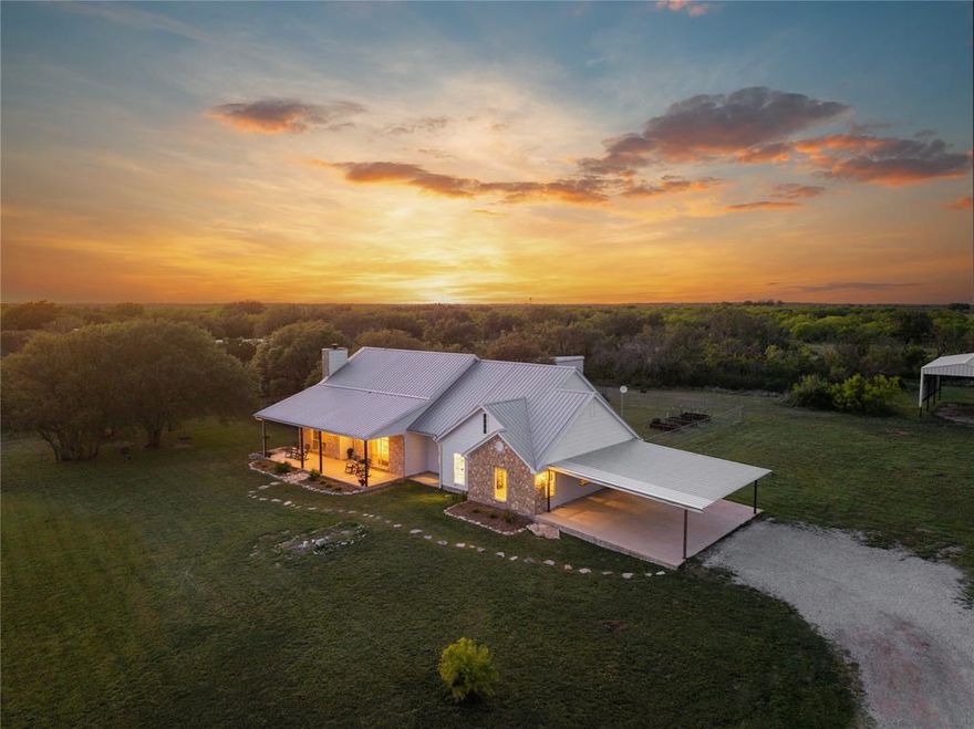 If wide-open spaces and a little personality are on your wish list, this 4-bedroom, 2-bath custom home on 9.363 acres in the heart of Central Texas is ready to impress. Surrounded by similar-sized properties, enjoy peace, privacy, and true country living without feeling isolated. Inside, a warm and inviting living area features a soaring vaulted ceiling with beautiful tongue-and-groove pine and a cozy wood-burning fireplace—perfect for gathering on cool Texas evenings. Thoughtful custom details and quality finishes shine throughout, along with a spacious laundry and utility room built for everyday living. Step outside to oversized covered front and back patios, ideal for morning coffee or sunset views. The backyard is ready for entertaining with a firepit area and a 27-ft above-ground pool. A 1,200 sq ft workshop and 880 sq ft RV cover provide ample space for storage, hobbies, and more. This property offers the perfect blend of comfort, function, and Texas charm.