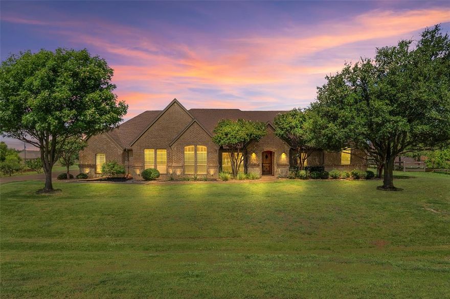 This charming home is on the lookout for its next loving owners — could it be you?  
Set on 1.19 acres with no HOA and no city taxes, this 4-bedroom, 3-bathroom retreat offers 3,025 sq ft of thoughtfully designed living space in the highly sought-after Northwest ISD — and it’s perfectly suited for adding the pool and shop you’ve always dreamed of for your backyard oasis.
Step inside and feel the warmth and charm of this home. From the gleaming engineered hardwood floors to the elegant crown molding, textured walls, and impressive 9 to 10-foot ceilings, every detail has been carefully curated to create a welcoming atmosphere. The primary suite is a true retreat, offering a luxurious jet tub, separate shower, dual vanities, and a walk-in closet large enough for a cozy seating area.
The heart of the home is the kitchen, designed for culinary enthusiasts with ample granite counterspace, a large island, walk-in pantry, and double oven. This space flows seamlessly into the dining and living areas, where you can enjoy views of the screened-in porch with its fireplace or out to the outdoor firepit and seating area nestled in the expansive backyard.
Perfect for entertaining year-round, the home features a 22x22 covered patio extension ideal for gatherings. The backyard also includes a 12x20 storage unit for all your tools and toys.
Additional highlights include built-ins throughout, generous walk-in closets, all-new carpet, fresh exterior paint, a newly poured driveway entrance, updated landscaping, and tons of builder upgrades. With ***NO pesky HOA and NO city taxes***, this home offers the freedom you want — and the affordability you need.
You’ll also find a dedicated office and a flex room, providing versatile spaces to suit your lifestyle needs.
Combining rural charm with upscale finishes, this property is a rare find in a peaceful neighborhood. Schedule your showing today and experience the warmth and comfort of country living at its finest.