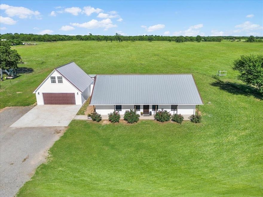 Enjoy peaceful country living in this 4-bedroom, 2-bath home located less than a mile from Highway 199. The open-concept living area creates an inviting layout suited for everyday living and entertaining. A large fourth room upstairs provides flexible space that can function as a home office, guest room, playroom, or additional living area. Set on 12 ag-exempt acres with established coastal Bermuda grass, the property offers ample room for livestock or recreational use. A private water well and no city taxes help reduce monthly expenses. With no restrictions, the land allows flexibility for future improvements such as a shop, pool, or additional dwelling. Enjoy the convenience of quick highway access while still experiencing rural surroundings, located approximately 25 miles from downtown Fort Worth.  Want more land? An additional 40 acres bordering this 12-acre property is for sale. See MLS listing 21162684..