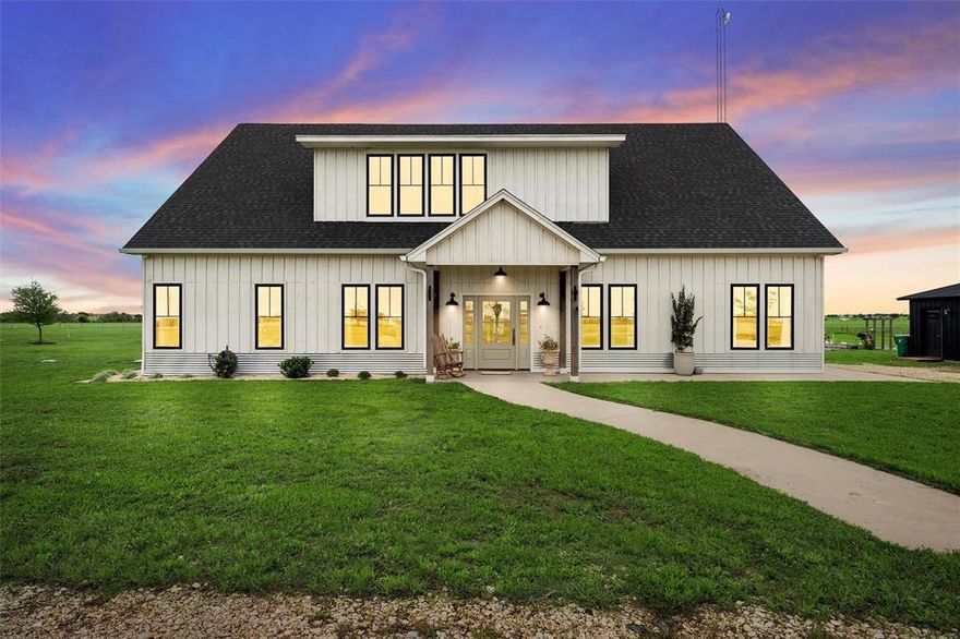 This stunning Crawford Ranchette offers a perfect blend of spacious country living and modern amenities. With five bedrooms and three bathrooms, it caters to families and those seeking additional space for hobbies or work. The open concept living area seamlessly connects the kitchen, which is a chef's dream featuring a Blue Star range, quartz countertops, a stainless steel column refrigerator, two dishwashers, an oversized island, and dual sinks—ideal for both everyday cooking and entertaining.

Natural light floods the home thanks to the abundance of windows, enhancing the welcoming atmosphere. The master suite serves as a luxurious retreat with heated bathroom floors, marble flooring, and a freestanding soaker tub for ultimate relaxation. On the first floor, two additional bedrooms offer flexibility for office or hobby spaces, while the upstairs features two more bedrooms with a convenient Jack and Jill bathroom. Another convenient feature is the second washer and dryer upstairs! No need to move clothes from one story to the other.

Outside, tranquility reigns. The expansive grounds provide ample space for animals, complete with three shelter barns suitable for horses, goats, or cattle. The spacious chicken coop is also another stand out feature and is equipped with electric for all your poultry needs. The impressive modern barn is a standout feature currently housing a gym, a homesteading room, a milking room, and a large office space upstairs, making it perfect for various uses. HOWEVER, the possibilities are endless for this space. It could be used for anything you can dream up! 

Set within the Crawford ISD, this easy-to-maintain, fully fenced acreage is a rare find that promises peaceful living just a short drive from Waco. This property truly embodies the essence of country living with all the comforts of modern life.