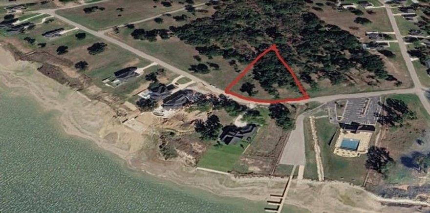 Beautiful Homesite in Cedar Creek Landing! Discover an incredible opportunity to build your dream home on this spacious 0.55 acre lot, perfectly positioned to capture stunning water views. Situated just steps away and catty-corner from the elegant community clubhouse visible right from the property. You’ll enjoy convenient access to upscale amenities, including boat slips, a resort-style pool, and a state-of-the-art fitness center. Located within a prestigious gated community, this property offers the perfect balance of luxury and serenity. Experience lakeside living at its finest while still benefiting from an easy commute to Dallas and close proximity to local shopping, golf courses, dining, and schools. Don’t miss your chance to create the home you’ve always envisioned in this beautiful waterfront community!
