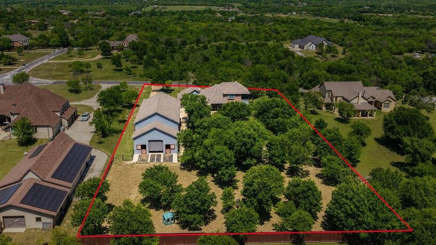 Spacious, upgraded, and built for both lifestyle and functionality, this unique property offers the perfect blend of indoor comfort and exceptional outdoor living. Inside, you’ll find generous living spaces designed for everyday living and entertaining, while the true highlights are outside.

Enjoy your own private retreat featuring a fully equipped outdoor kitchen ideal for hosting year-round. The property is set up for equestrian or hobby farm use with a custom 2-stall horse barn and approximately half an acre of pipe-fenced pasture.

The barn features oversized foaling stalls with custom doors and windows, premium Stall Saver flooring, and plumbing for automatic waterers. It’s prepped for foam insulation, with feed and tack rooms roughed in for HVAC. Additional amenities include a wash rack, multiple water access points, and wide gates for easy equipment and livestock access.

The 36’ x 65’ shop (36’ x 85’ overall with barn) offers incredible versatility with space for a gym or workspace, plus a heavily reinforced safe room with custom safe door and HVAC rough-in. The mezzanine level includes a full bath, wet bar rough-in, and is prepped for HVAC ideal for office or entertainment space.

Built for durability, the shop includes a reinforced slab, added structural supports, separate electrical panel tied to the home and Generac generator, gas lines, lift station, and high-speed internet.

Major 2022 upgrades include Low-E windows, two TRANE HVAC systems with WiFi thermostats, fully encapsulated foam attic, added fresh air vents, WiFi garage doors for home-shop-barn, and a new 30-year composition roof. A Generac whole-home generator provides added peace of mind.

This property offers a rare combination of modern upgrades, land flexibility, and outdoor living—perfect for those looking to live, work, and play in one place.