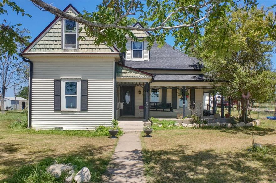 Step into wide-open Texas living on 18.93 acres anchored by a rare historic farmhouse believed to originate from the Sears catalog era, offering timeless character with select updates already completed and the opportunity for the next owner to finish it out to their own vision. From the front porch, the views stretch for miles, and on a clear night you can see the sale barn lights glowing to the west, a reminder of the deep ranching roots of the area. The land is pipe fenced and cross fenced for functionality and includes a well-built 45x45 metal livestock barn with six stalls, six runouts, and a tack room, along with water and electricity in place. An approximately 100x225 riding arena, a small tank, and expansive pasture make this property ideal for horses, livestock, or a true rural homestead ready for its next chapter.